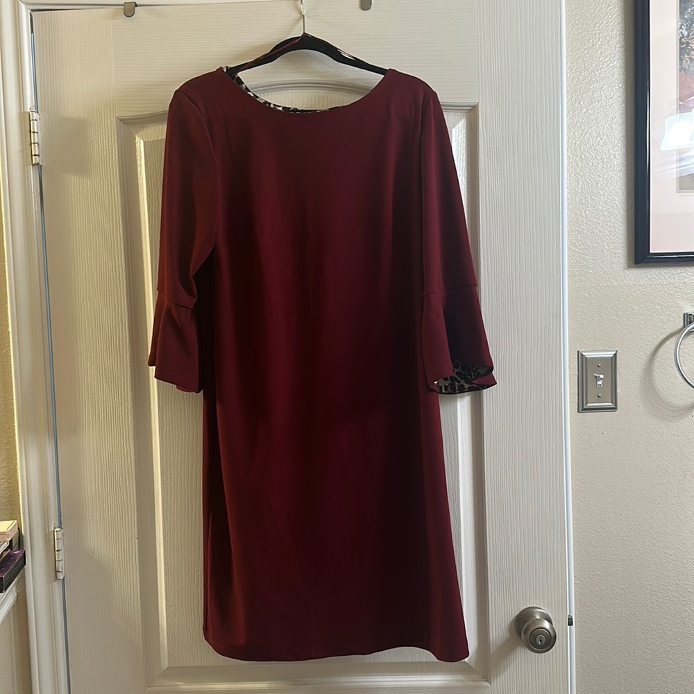 Burgundy, with flutter 3/4 sleeves, Zips up in back, Animal print accents
